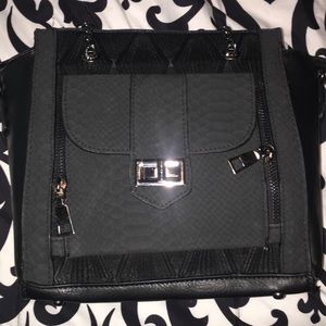 Black Purse. Brand New. Still has tag and all.